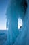 A large ice formation from icicles hanging from a cliff.