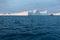 Large iceberg and boat in the Disko Bay, Greenland. The source of these icebergs is the Jakobshavn glacier.