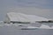 Large iceberg stretching across horizon at Twillingate Harbour