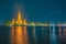 large illuminated temple Wat Arun ratchawararam at twilight