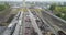 Large industrial area top view. Industrial complex aerial view. Gantry cranes and trucks near a large warehouse