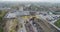 Large industrial area top view. Industrial complex aerial view. Gantry cranes and trucks near a large warehouse