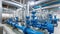 Large industrial boiler room and water treatment facility, blue pumps, shiny stainless metal pipes, and valves