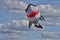 A large inflatable shark kite in front of cloudy sky