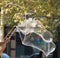 Large Iridescent Bubble with bamboo poles and string.