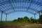 A large iron frame for the roof of the futsal field building