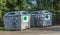 Large iron garbage containers green zone day closeup