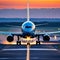 large jetliner taking off from anrport runway at sunset or dawn with the landing