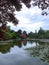 Large lake in a garden with trees