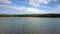 Large Lake Upper View against Thick Forest on Bank