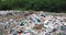 A large landfill near the metropolis of Tokyo. Toxic plastic waste. Mountains of garbage