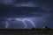 Large lightning strike at night on Tornado Alley