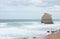 A large lonely cliff at the sea at the Great Ocean Road in Australia