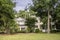 Large luxury two story home on wooded lot with gardens
