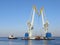 Large maritime cranes and boat