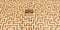 Large maze or labyrinth over brown background, success, strategy or solution concept