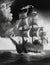 a large medieval ship sailing the ocean and in black and white illustration