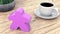 A large meeple next to a cup of coffee. 3d render
