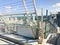 Large metal chrome shiny stairs with railings on the roof of a glass skyscraper, a tall building with a panoramic view