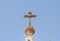 Large metal cross on top of the St. Nicholas church bell tower in Bay Jala - a suburb of Bethlehem in Palestine