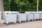 Large metal filled garbage containers on the street