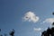 Large military helicopter hovers in sky. A camouflaged helicopter flies at high speed