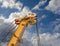 Large mobile construction crane on blue sky backgro