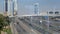 Large modern road junction in Dubai in summer day, cars are moving with high speed on highway