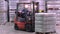 Large modern warehouse with forklifts at brewery