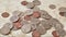 A large mound of coins appearing on a table