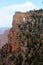 Large mountain of rock, at the top a lookout and in the middle a crack in the shape of a triangle.