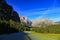 The large mountains with clear blue skies and pine trees in the Swiss countryside village