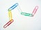 Large multi-colored paper clips. Paperclip of documents. Desktop