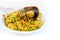 Large mussel on a paella portion, spanish street food of rice and seafood in a sustainable cardboard bowl and a wooden fork,