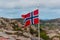 Large norwegian flag waving in the wind..