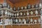 A large number of antique samovars on shelves