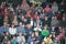 A large number of spectators sitting on the rostrum