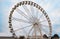 Large observation wheel on cloudy