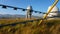 A large observatory is protected by a barbed fence