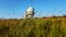 A large observatory is protected by a barbed fence