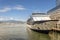 large ocean cruise liner is moored at the pier in a modern seaside town