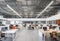 a large office with several computer screens on the desks