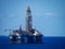 Large offshore oil rig in the middle of a vast expanse of ocean