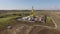 Large oil well in field, aerial view of industrial equipment