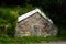 Large old 19th Century stone root cellar with sturdy wooden door