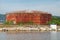 Large old rusted oil tank on the lake coast, Port of Varna