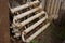 A large old rusty iron gray radiator