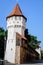 Large old white painted stone tower in the historical center of the Sibiu city, near Citadel Street and Park Strada si Parcul