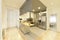 Large open kitchen with industrial style stainless steel cabinets and appliances,