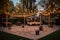 large outdoor dance floor surrounded by twinkle lights and lanterns